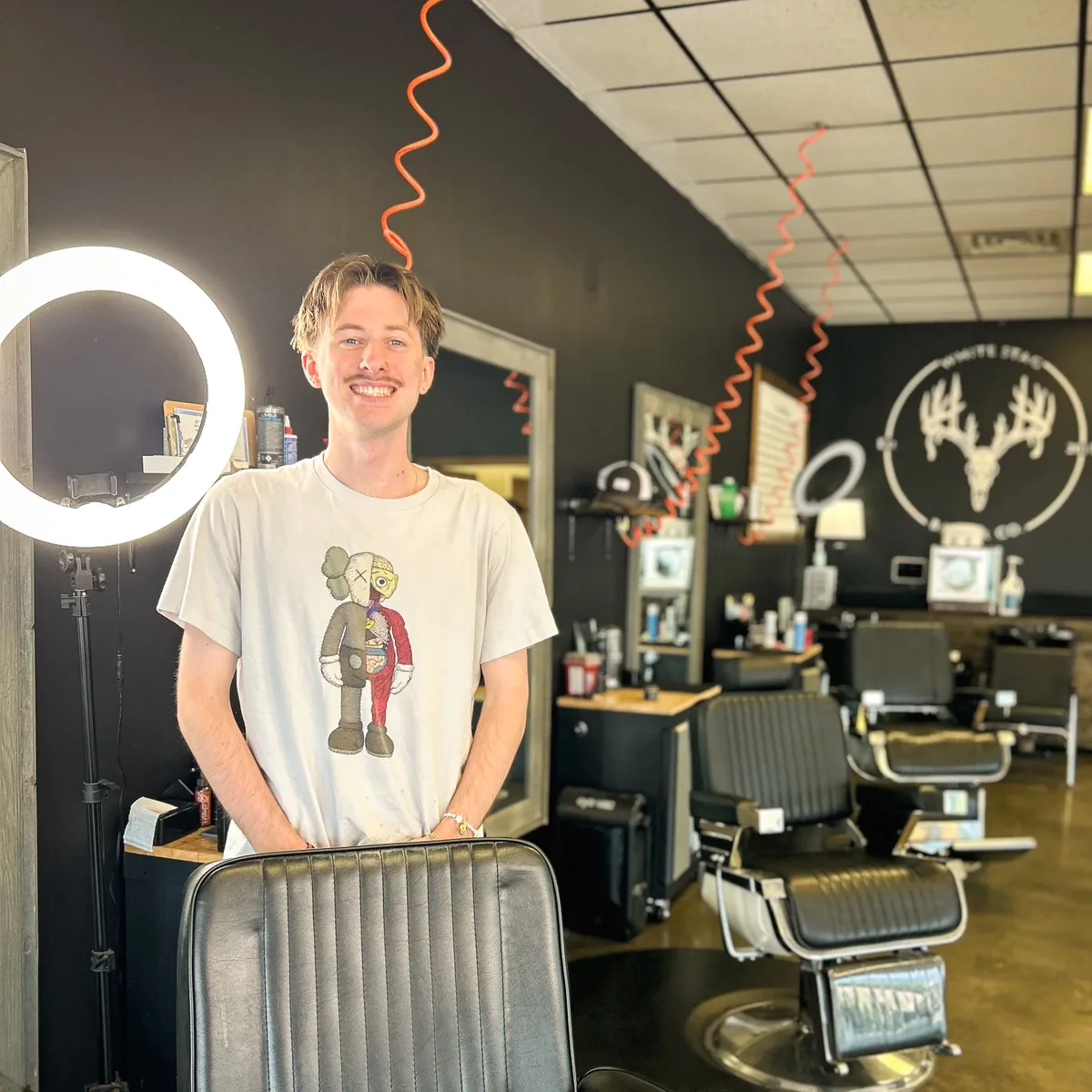 Austyn, barber at White Stag Barber Co.
