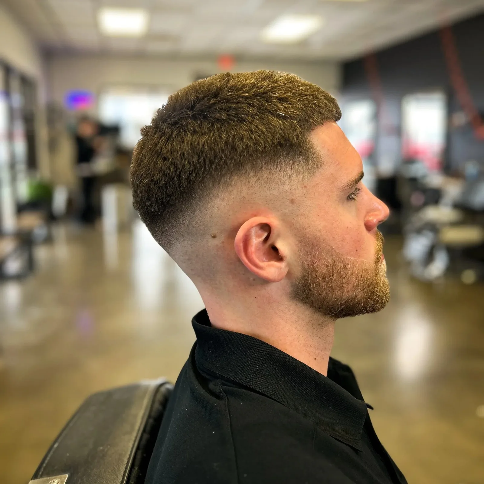 Crisp mid fade cut at White Stag Barber Co.